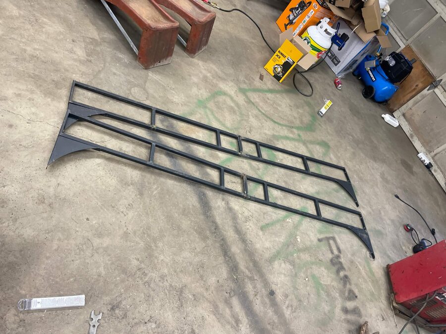 Fabricated steel rail frame